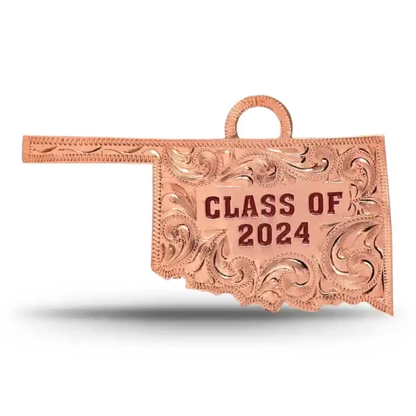 A custom silver tassel charm for 2024 graduates, designed for memorial caps, featuring a Oklahoma State Shape